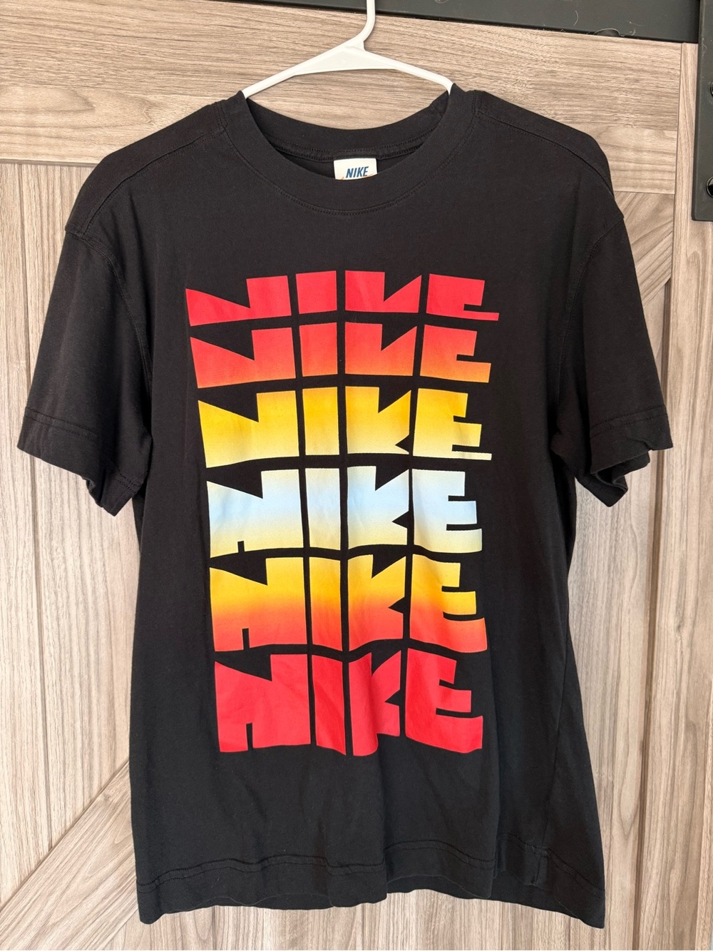 Vintage Nike Black Tee with Gradient Multi-Color Logo